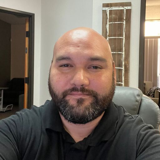 A headshot image of Jason Stringer