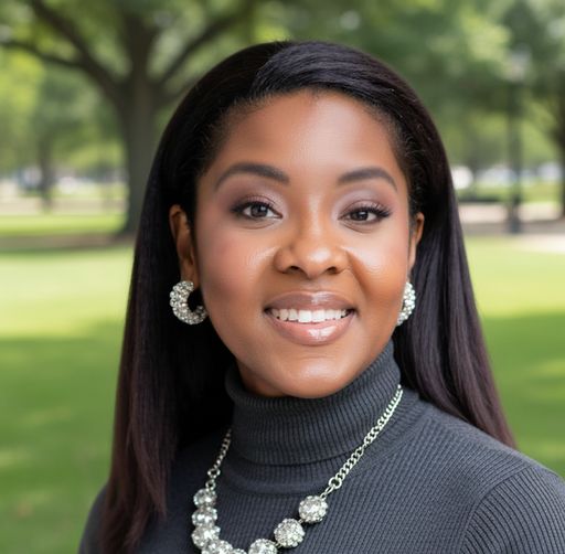 A headshot image of Reynette Romain