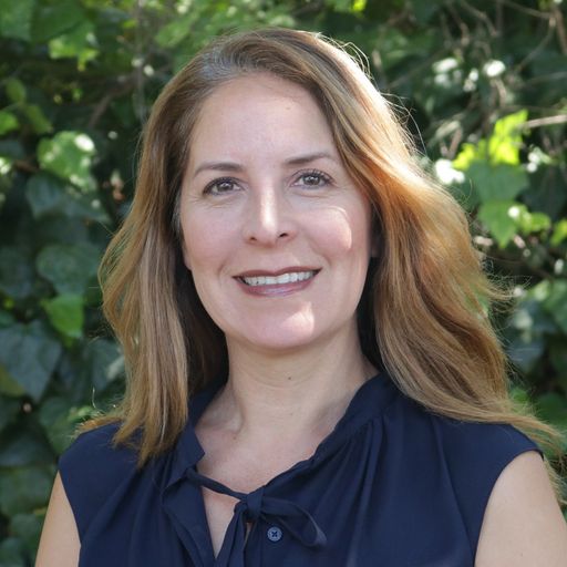 A headshot image of Denna Sanchez