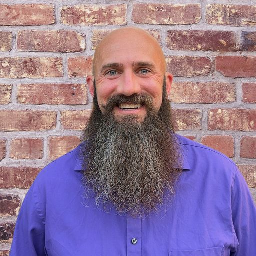 A headshot image of Geoffrey Hall