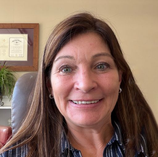 A headshot image of Joanie Defibaugh