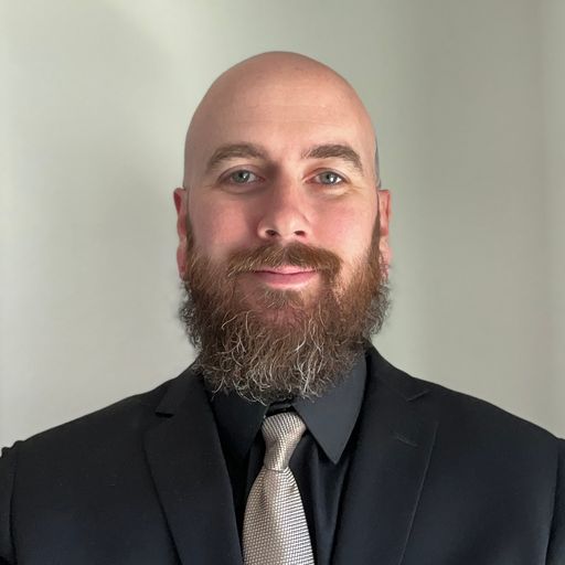 A headshot image of Timothy Hennigan