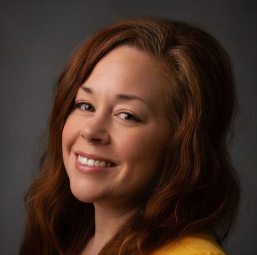 A headshot image of Simone Dugal Webster