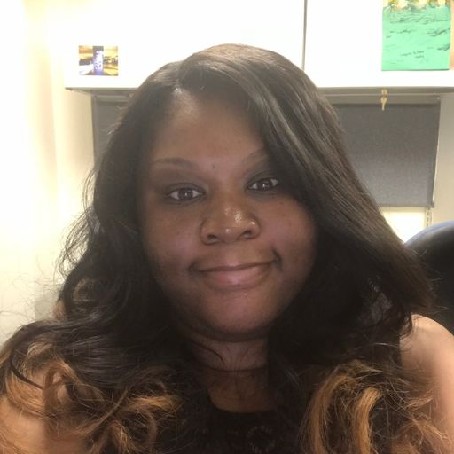 A headshot image of Tameka Joy-Hawkins