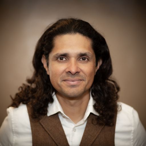 A headshot image of Alvaro Quesada
