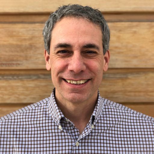 A headshot image of Michael Capre