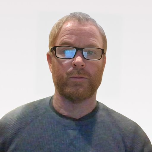 A headshot image of Eric Miklusicak